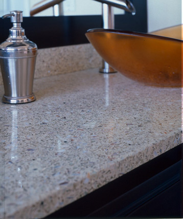 
After: Michelle loves her new, recycled-content EnviroSlab counters. "They're different looking, but they're not like 'oh my gosh, what is that?'. They're similar to granite", she says. 
